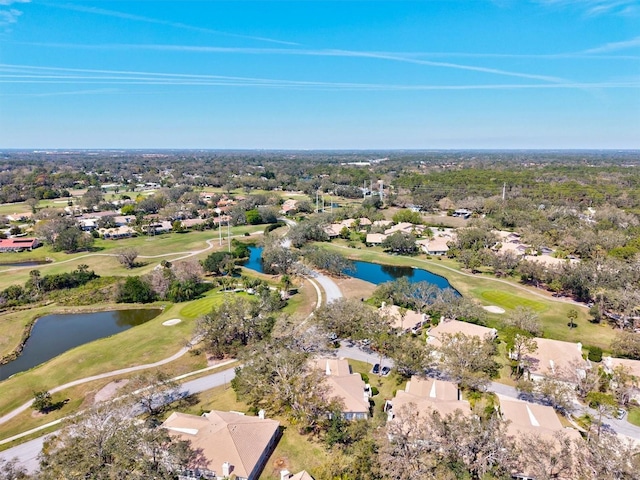 drone / aerial view with a water view, a residential view, and golf course view