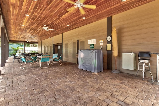 view of patio / terrace featuring fence, a ceiling fan, and outdoor dining space