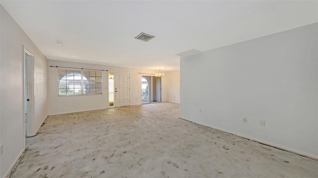 foyer featuring a healthy amount of sunlight and a notable chandelier