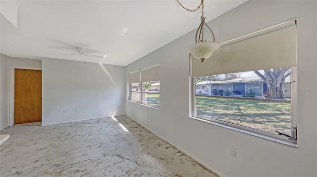 unfurnished room featuring ceiling fan and lofted ceiling