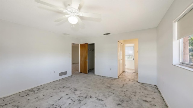 unfurnished bedroom featuring light colored carpet and ceiling fan