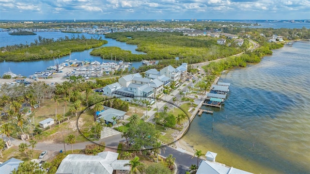 drone / aerial view featuring a water view and a residential view