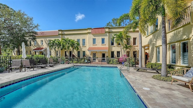 view of swimming pool featuring a patio