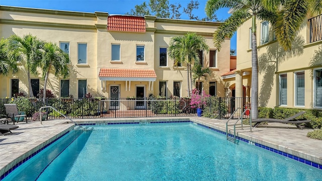 view of swimming pool with a patio area