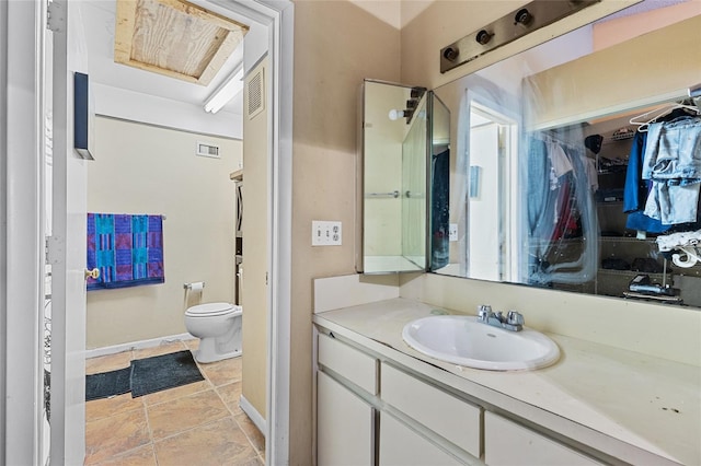 bathroom featuring toilet, visible vents, and vanity