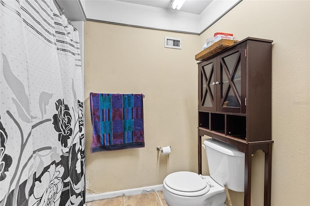 full bath with toilet, baseboards, visible vents, and tile patterned flooring