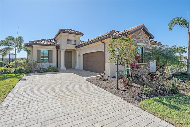 mediterranean / spanish house with a garage