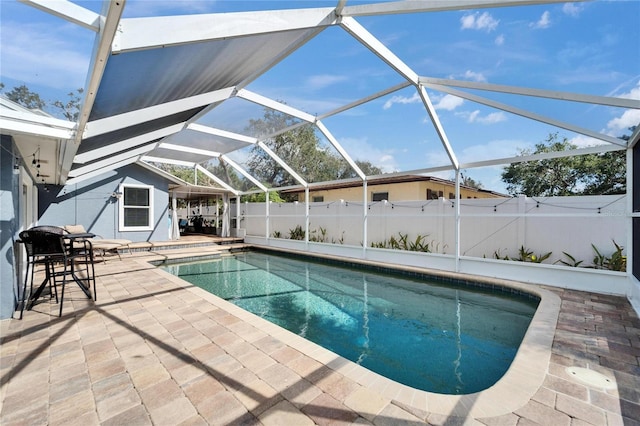 view of pool featuring a fenced in pool, a lanai, a fenced backyard, and a patio