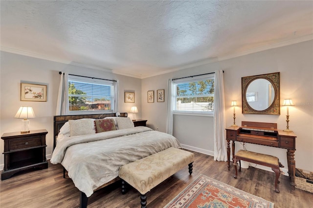 bedroom featuring a textured ceiling, wood finished floors, and crown molding