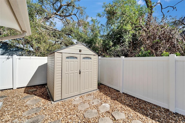 view of shed featuring a fenced backyard