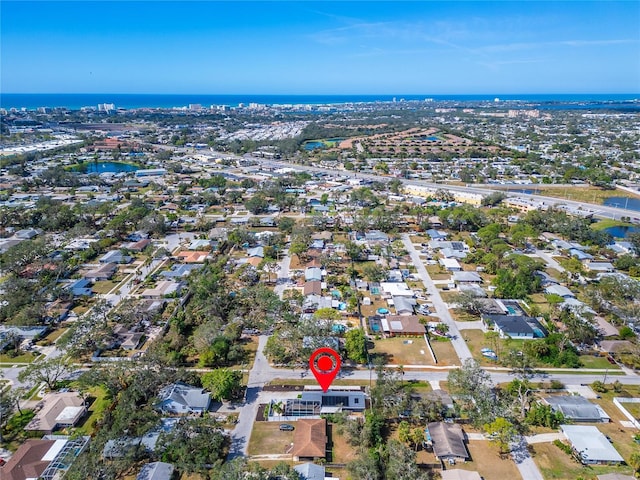 birds eye view of property with a residential view and a water view