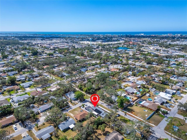 bird's eye view featuring a water view and a residential view