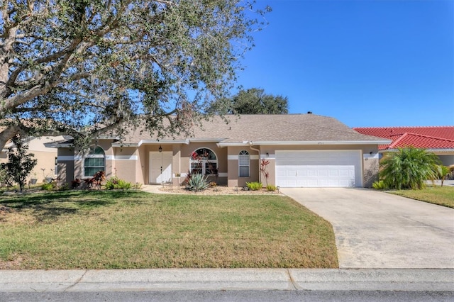 single story home with stucco siding, an attached garage, driveway, and a front lawn