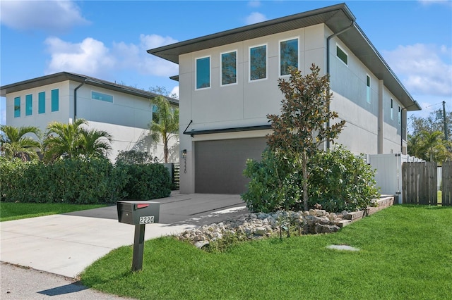 view of front facade featuring a front yard and a garage