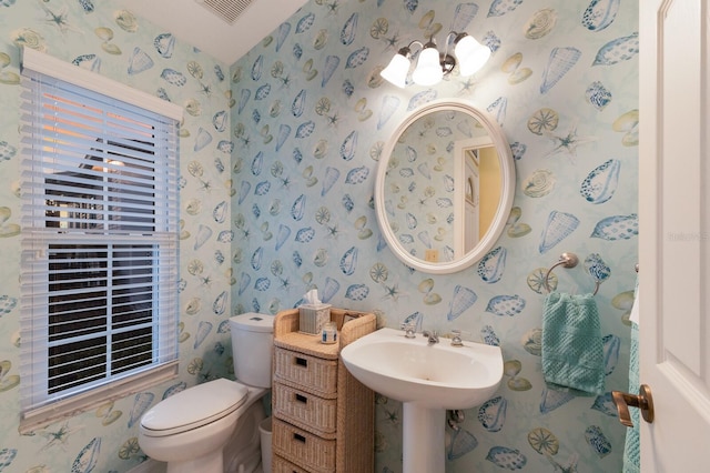 1528 43rd Avenue Dr W, Palmetto, FL 34221 - half bathroom featuring visible vents, a sink, wallpapered walls, and toilet