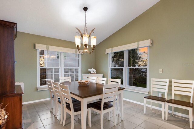 1528 43rd Avenue Dr W, Palmetto, FL 34221 - dining space featuring baseboards, tile patterned flooring, vaulted ceiling, and an inviting chandelier