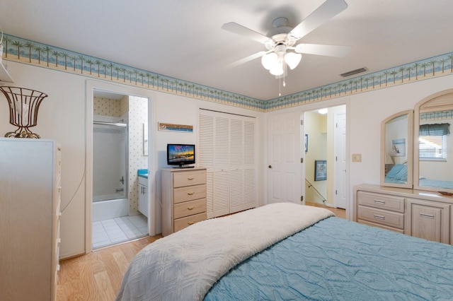 1528 43rd Avenue Dr W, Palmetto, FL 34221 - bedroom with a closet, light wood-type flooring, connected bathroom, visible vents, and ceiling fan