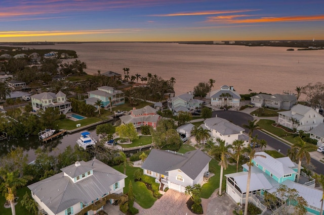 1528 43rd Avenue Dr W, Palmetto, FL 34221 - aerial view at dusk with a water view and a residential view