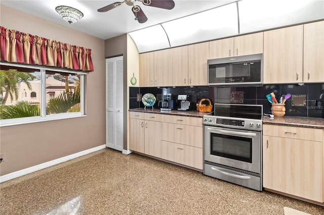 kitchen with stainless steel appliances, light brown cabinets, backsplash, and baseboards