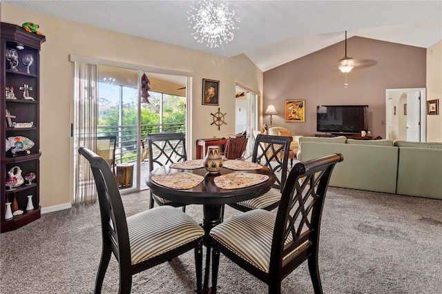 dining room featuring carpet floors, baseboards, a notable chandelier, and lofted ceiling