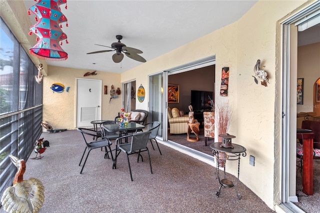 sunroom / solarium with ceiling fan