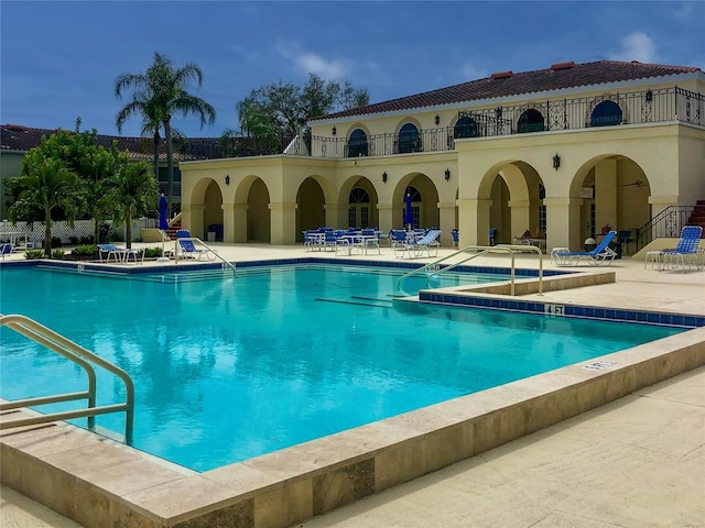 pool featuring a patio area