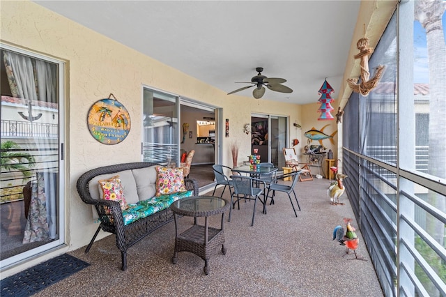 sunroom with a ceiling fan