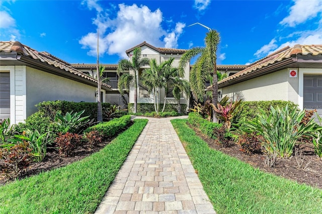 view of property's community with a garage