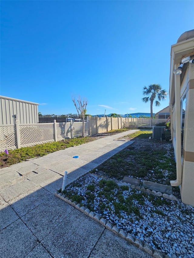 view of yard featuring cooling unit and a fenced backyard