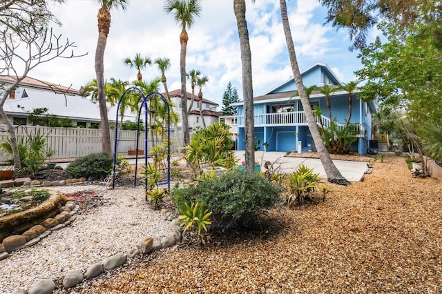 exterior space featuring fence and a balcony