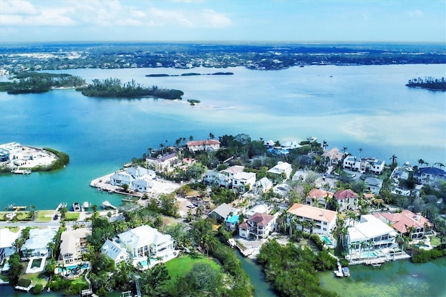 birds eye view of property with a water view and a residential view