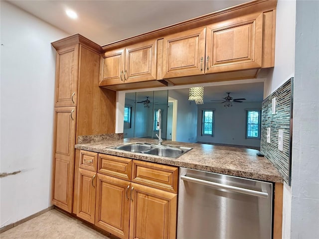 kitchen featuring dishwasher, ceiling fan, light tile patterned floors, sink, and kitchen peninsula