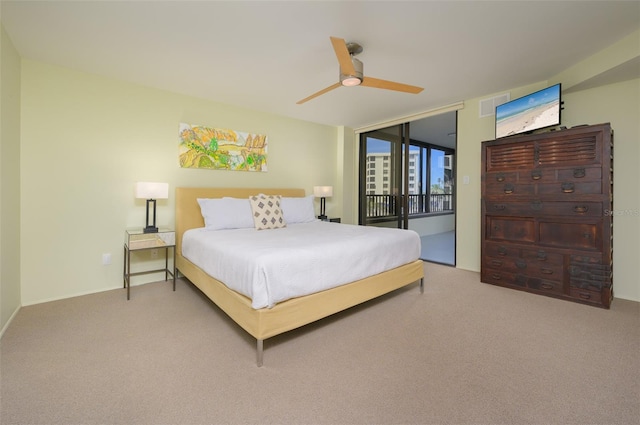 bedroom featuring carpet floors, access to outside, visible vents, and a ceiling fan