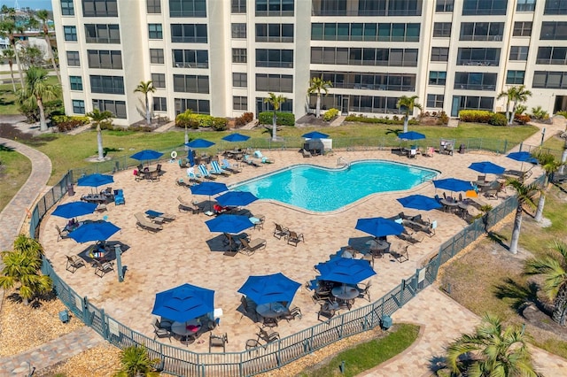 view of swimming pool with fence and a patio