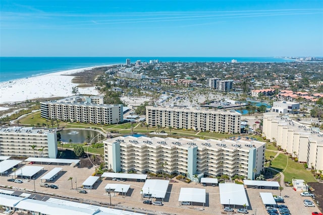 birds eye view of property featuring a view of city and a water view