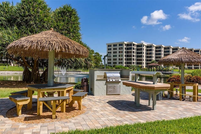 view of patio / terrace featuring a gazebo, area for grilling, and a grill