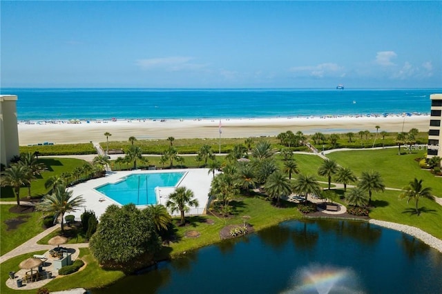 aerial view with a water view and a view of the beach