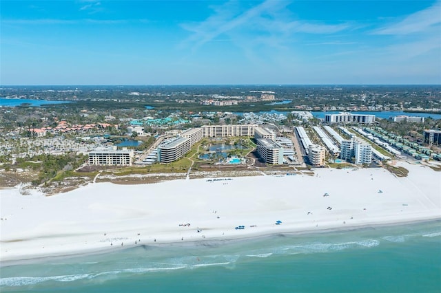 bird's eye view featuring a water view, a city view, and a view of the beach