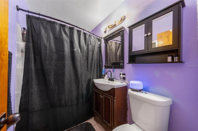 full bath featuring toilet, curtained shower, vanity, and tile patterned floors