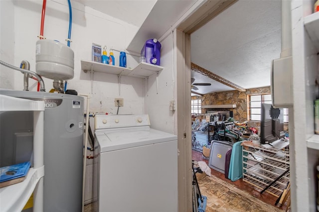 clothes washing area with washer / dryer, laundry area, water heater, and a ceiling fan