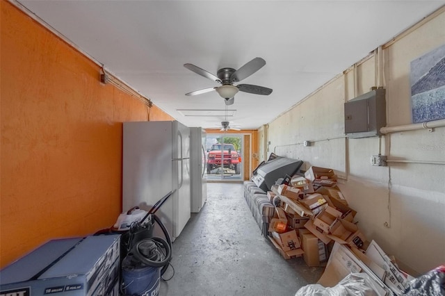 miscellaneous room with concrete floors and a ceiling fan