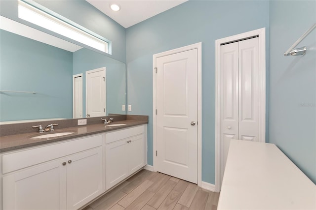 bathroom featuring wood-type flooring and vanity