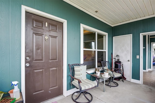 view of exterior entry with covered porch