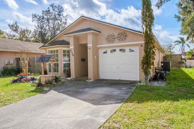 view of front of home with a front yard, a garage, and central air condition unit