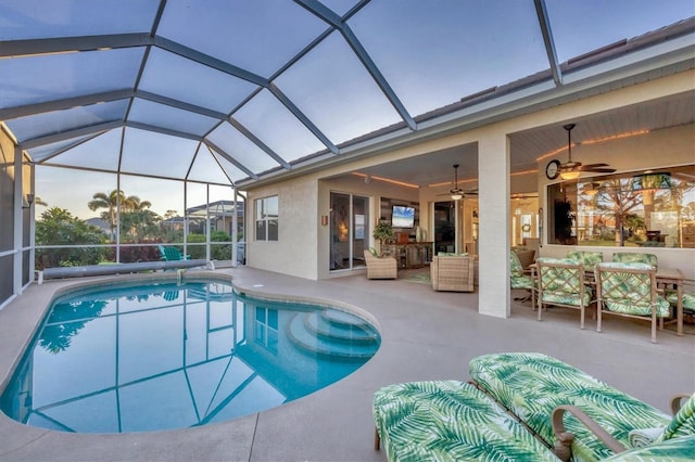 view of pool featuring an outdoor living space, a lanai, ceiling fan, and a patio area