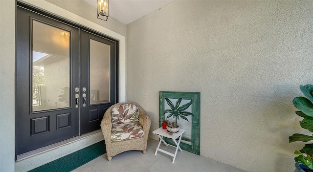 view of exterior entry featuring french doors