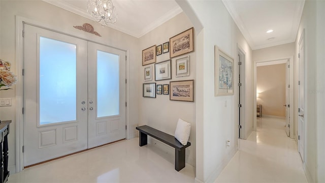 foyer entrance with ornamental molding, french doors, arched walkways, and baseboards