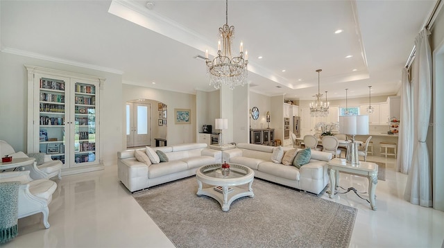 living room featuring arched walkways, a tray ceiling, ornamental molding, and an inviting chandelier