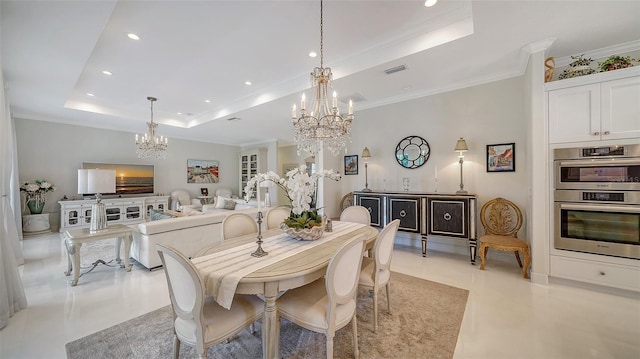 dining room featuring an inviting chandelier, visible vents, a raised ceiling, and ornamental molding