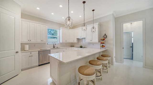 kitchen with a breakfast bar area, white cabinetry, a sink, and stainless steel dishwasher